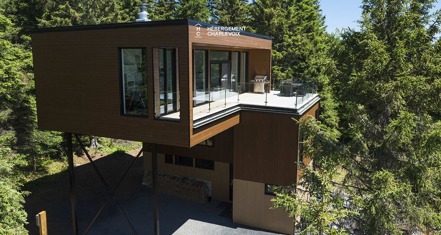 ABS-595 - Un feu de foyer suspendu dans un chalet de luxe à louer dans Charlevoix.