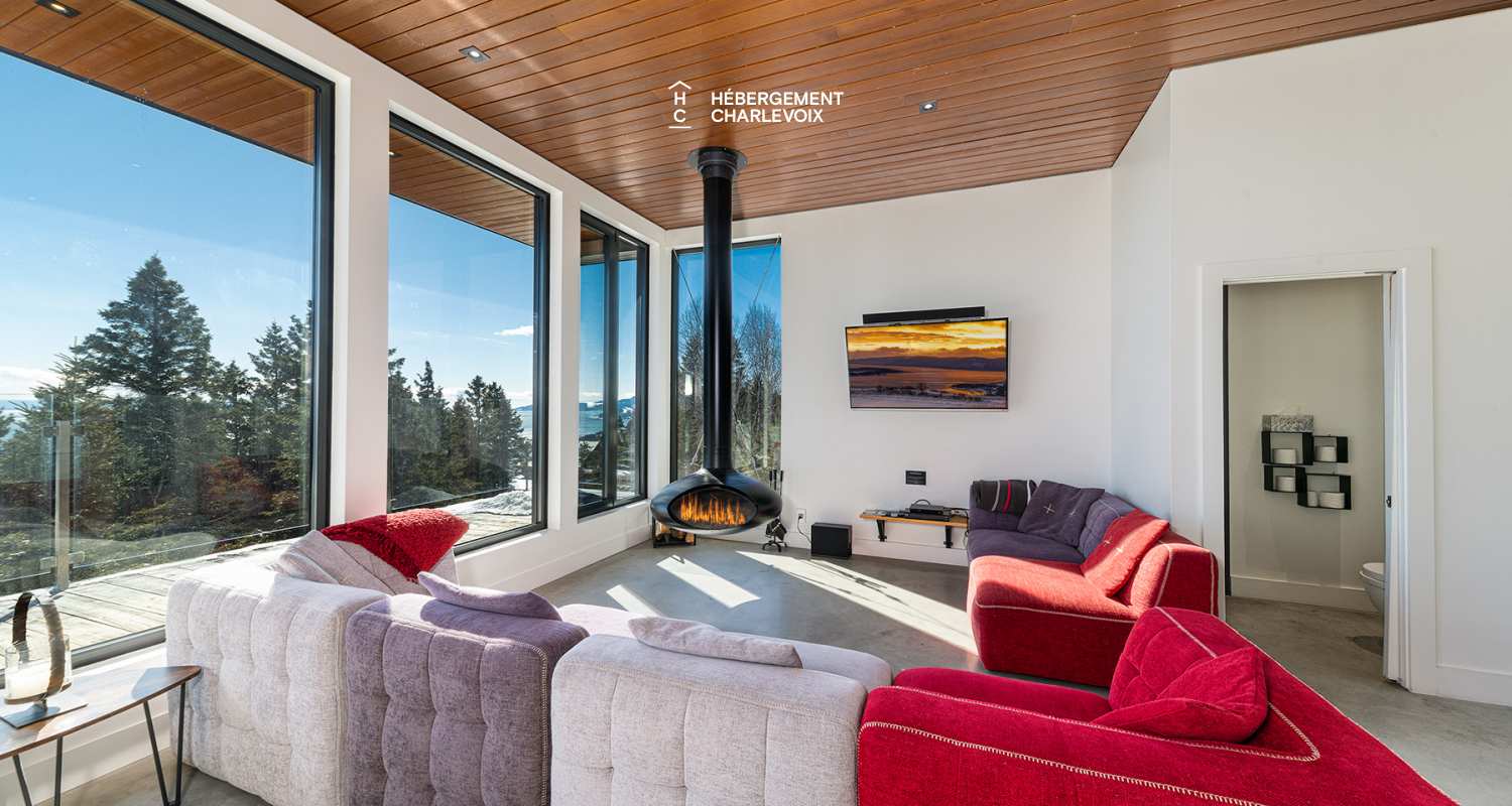 ABS-595 - Un feu de foyer suspendu dans un chalet de luxe à louer dans Charlevoix.
