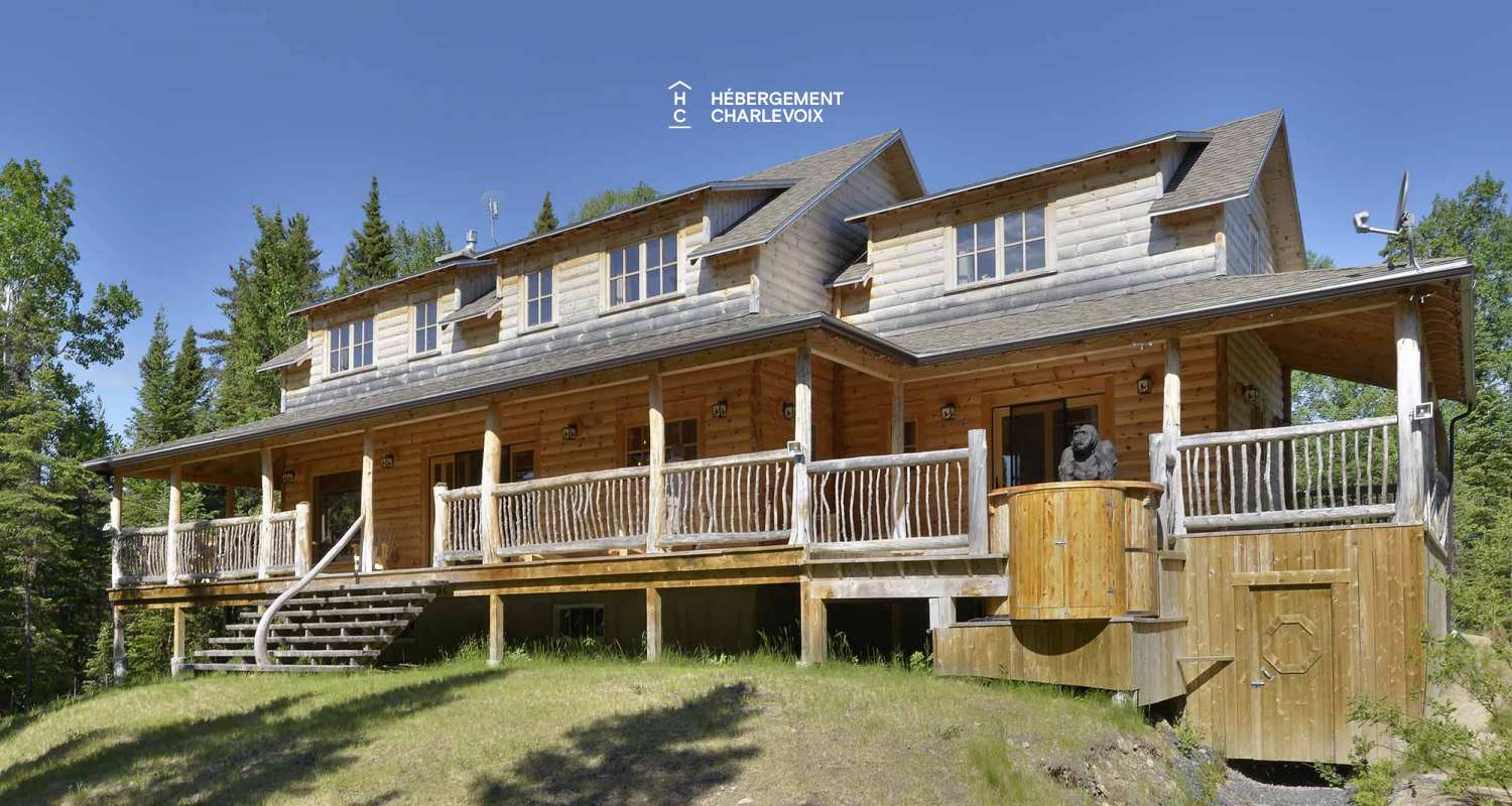 CAB-30 - A very large half-log cabin in the heart of the Canadian forest.