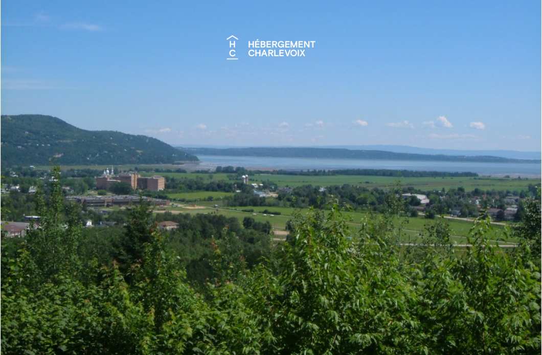 SEN-135-1 - Chalet jumelé avec vue lointaine sur le fleuve